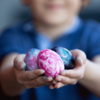 Boy holding Easter eggs