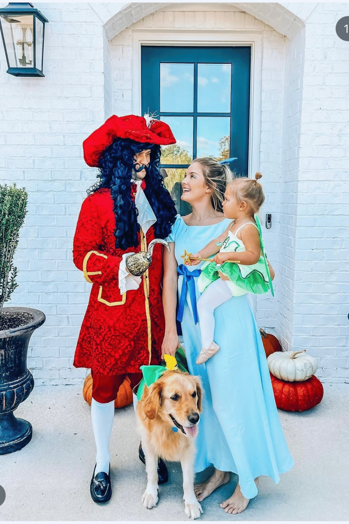 Father dressed as Captain Hook, mother as Lucy and daughter as Tinkerbell