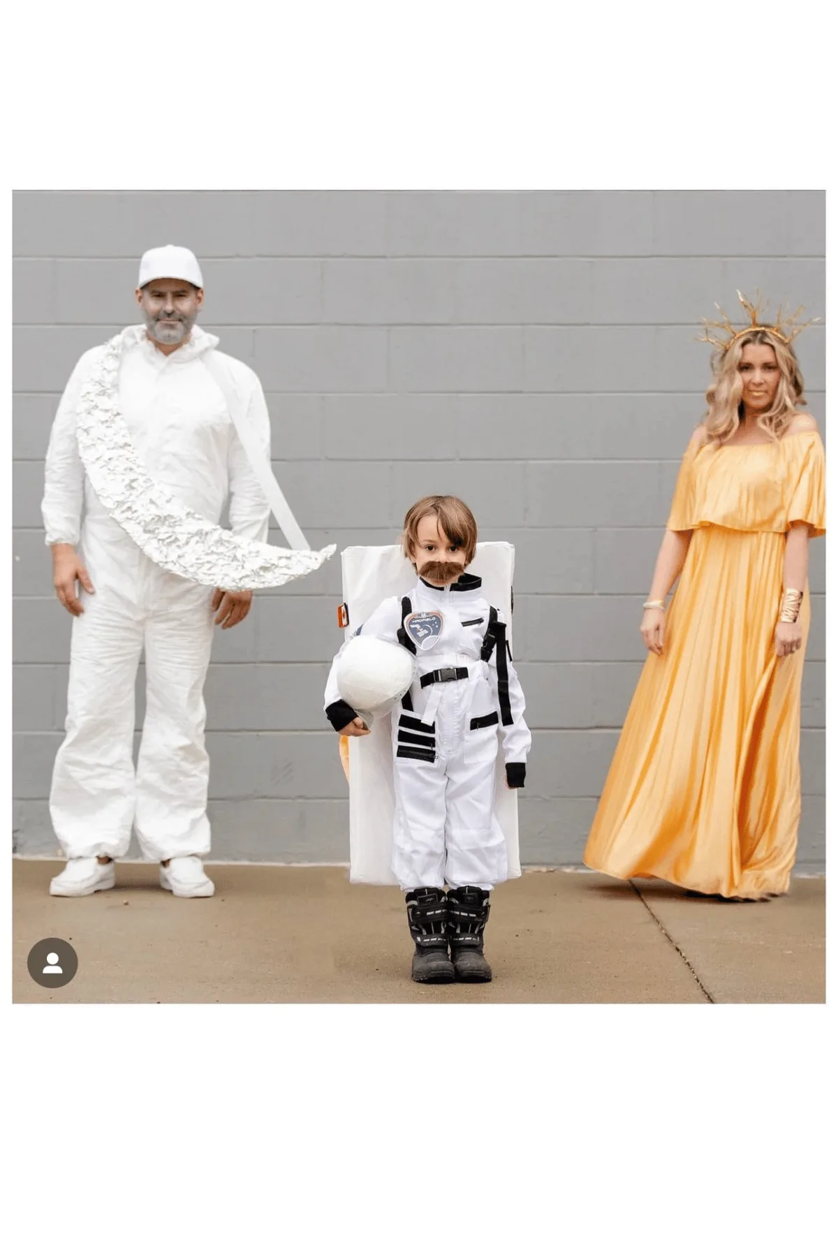 Father dressed as moon, mom as the sun and boy as an astronaut