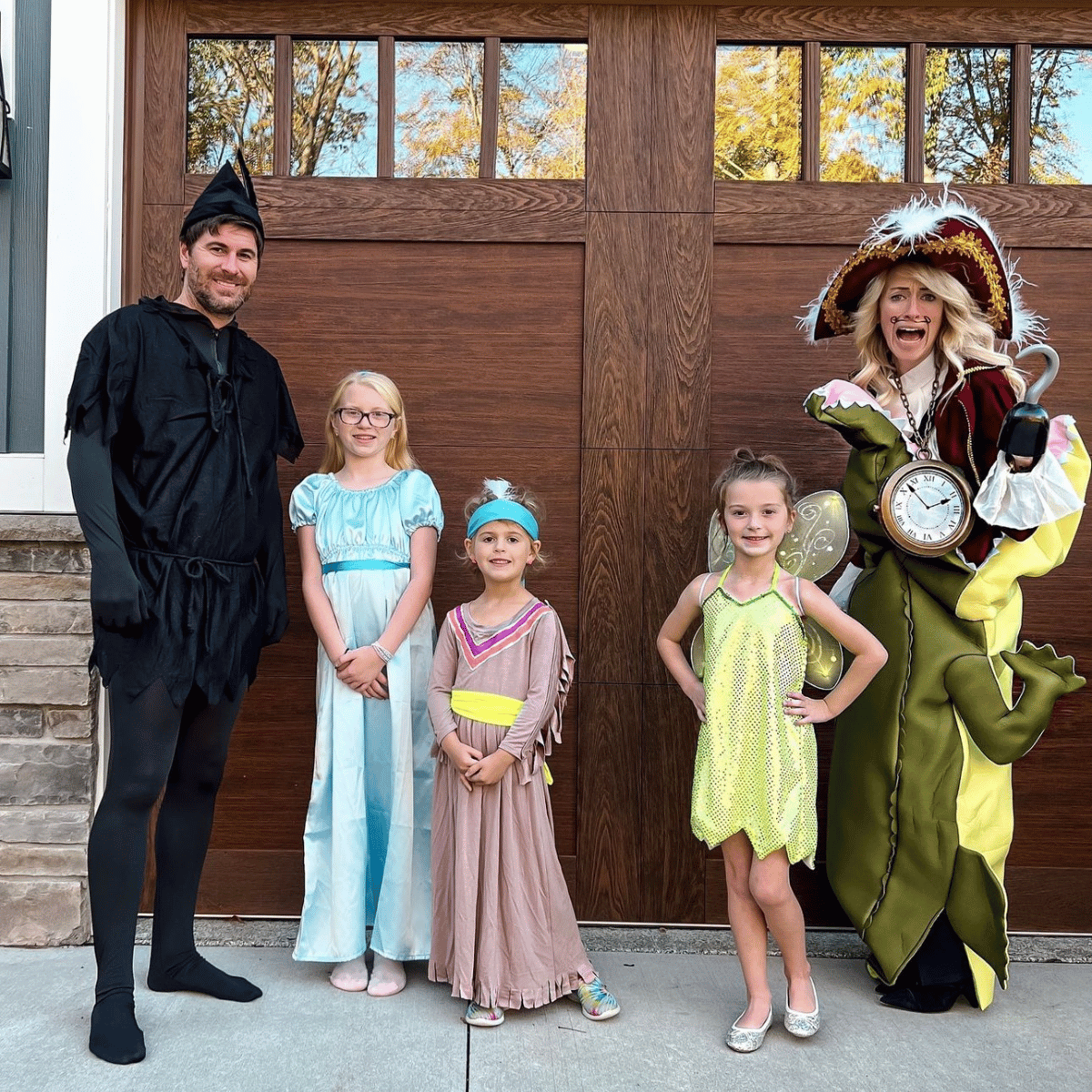 Family of 5 in Peter Pan costumes