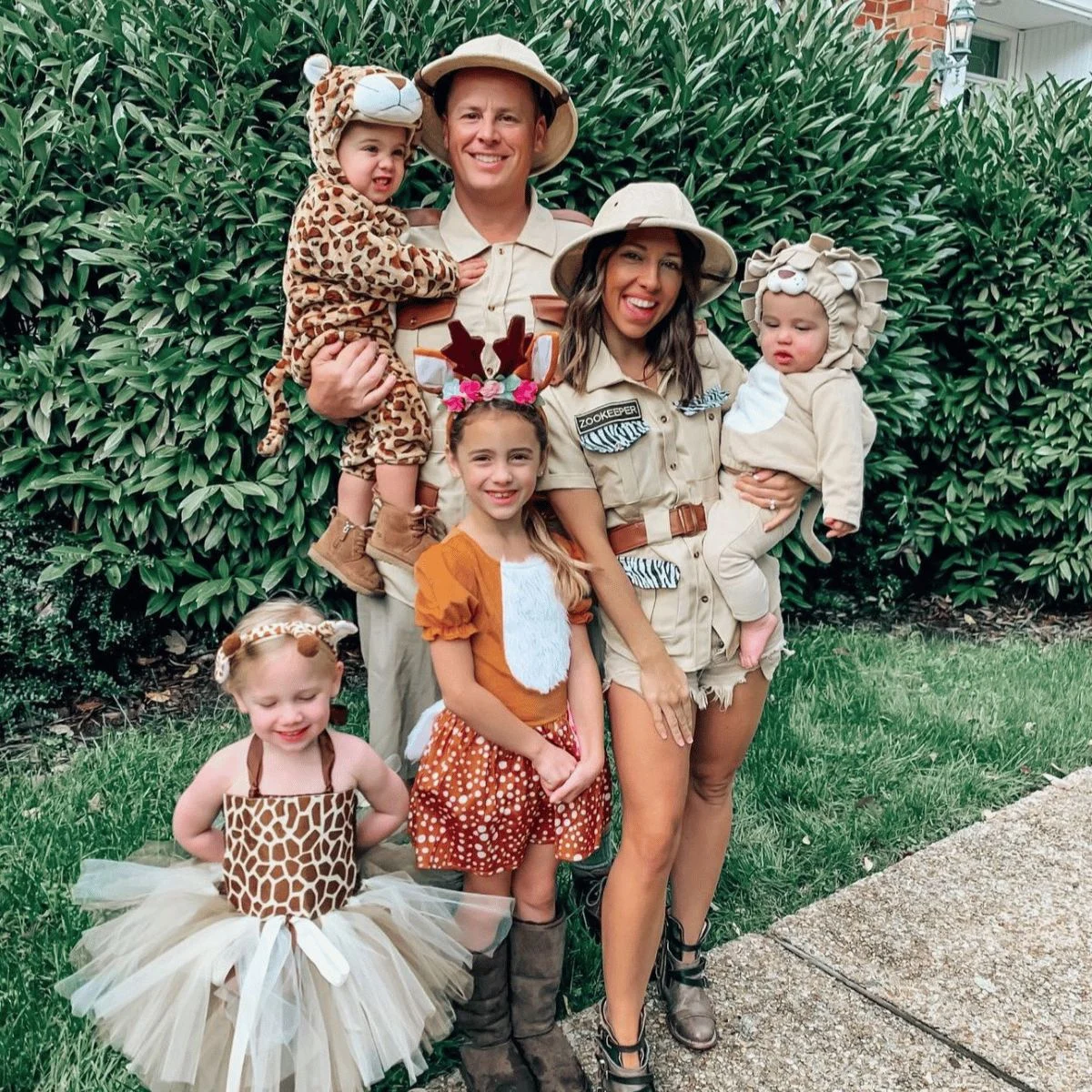 Parents dressed as zookeepers and kids dressed as animals